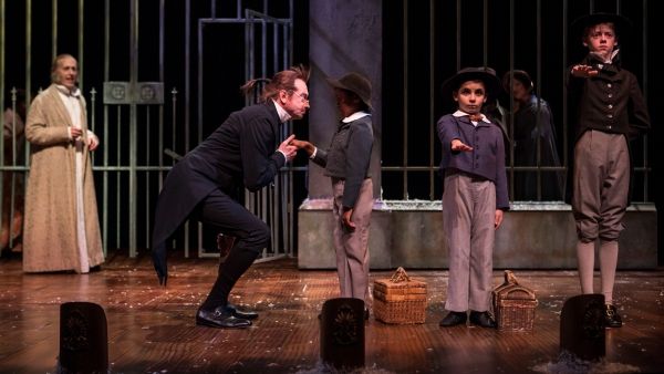Larry Yando (Scrooge), Larry Neumann Jr (School Master), Brynden Cleveland (Peter Cra Photo