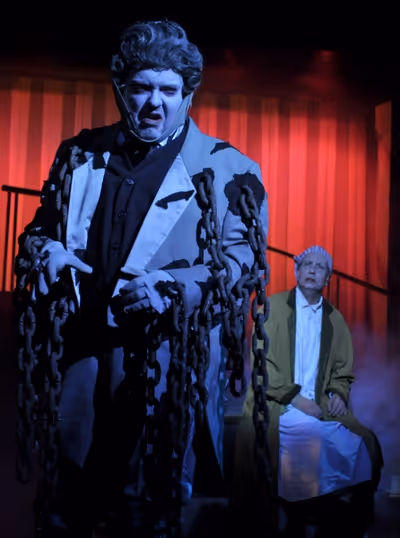 The ghost of Jacob Marley (Eddie Curry), left, warns Ebenezer Scrooge (Jeff Stockberg Photo