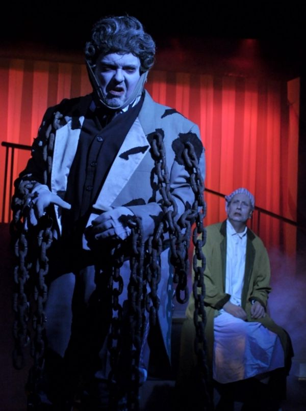 The ghost of Jacob Marley (Eddie Curry), left, warns Ebenezer Scrooge (Jeff Stockberg Photo