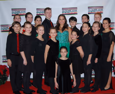 Gina Naomi Baez and the Kids Performing Who Kare Chorus Photo