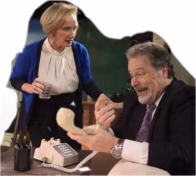 Frank (Scott Holmes) tries to explain what is happening at the other end of the phone Photo