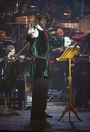 Kyle Scatliffe as the Ghost of Christmas Present Photo