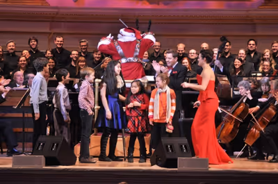 Santa Claus conducting The New York Pops with Steven Reineke and Ashley Brown Photo