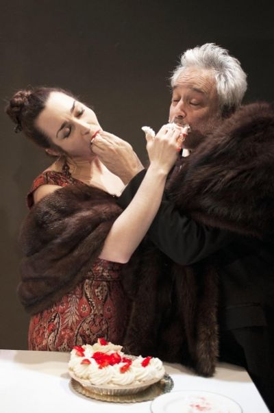 The gluttonous Mother (Ponder Goddard) and Father Ubu (David Sinako) over-indulge in  Photo