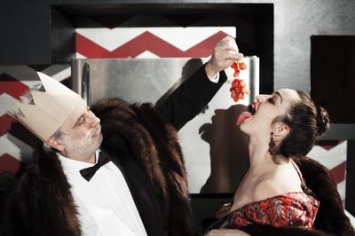 The gluttonous Mother (Ponder Goddard) and Father Ubu (David Sinako) over-indulge in  Photo
