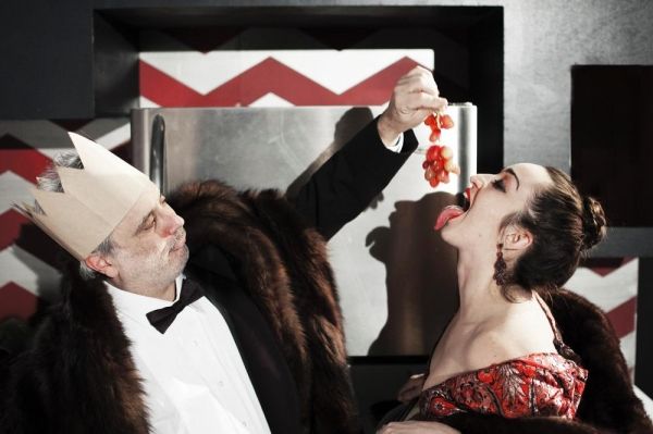 The gluttonous Mother (Ponder Goddard) and Father Ubu (David Sinako) over-indulge in  Photo