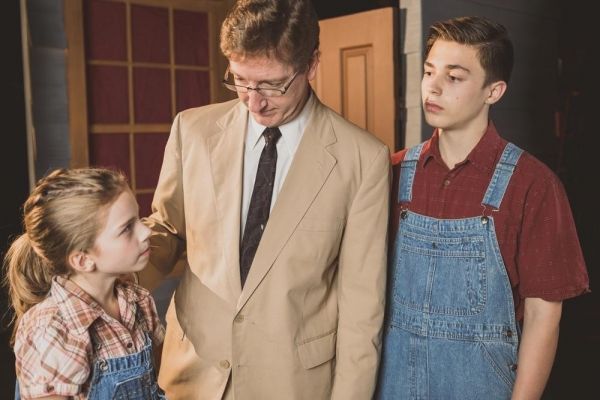 Liberty Evans-Agnew as Scout, Jim Rogers as Atticus Finch, Gunnar Johnson as Jem Photo