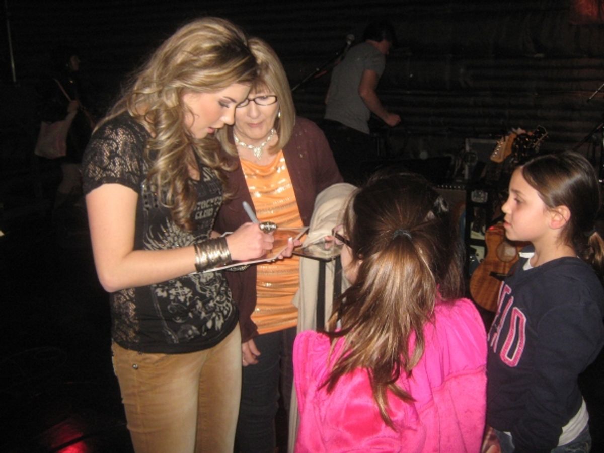 Singer Kaitlyn Baker signs autographs, following performance at 
