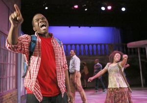 (foreground) Jonathan Butler-Duplessis plays Steven, president of the Flint Future Detectives and on a mission to solve a mystery about a dollar bill with too many zeroes and an unexpected face @ BroadwayWorld (foreground) Jonathan Butler-Duplessis plays Steven, president of the Flint Future De Photo