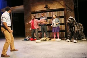 Elmwood (Bear Bellinger, back to camera) catches his son Steven (Jonathan Butler-Duplessis) with Steven’s fellow Flint Future Detectives Russell (Travis Turner), Richelle (Ashley Elizabeth Honore) and Zoopy the dog (puppeteer Sam Deutsch) searching @ BroadwayWorld Elmwood (Bear Bellinger, back to camera) catches his son Steven (Jonathan Butler-Dupl Photo