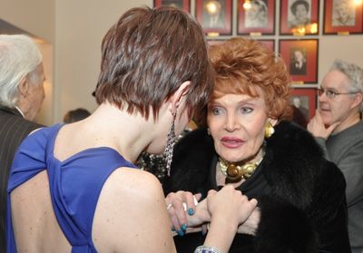 Edith Drake congratulates Carole J. Bufford Photo