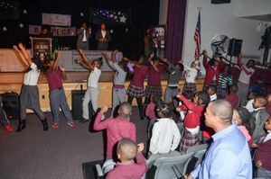 Former Giants players Jessie Armstead and Antonio Pierce surprise East Orange''s Anti Photo