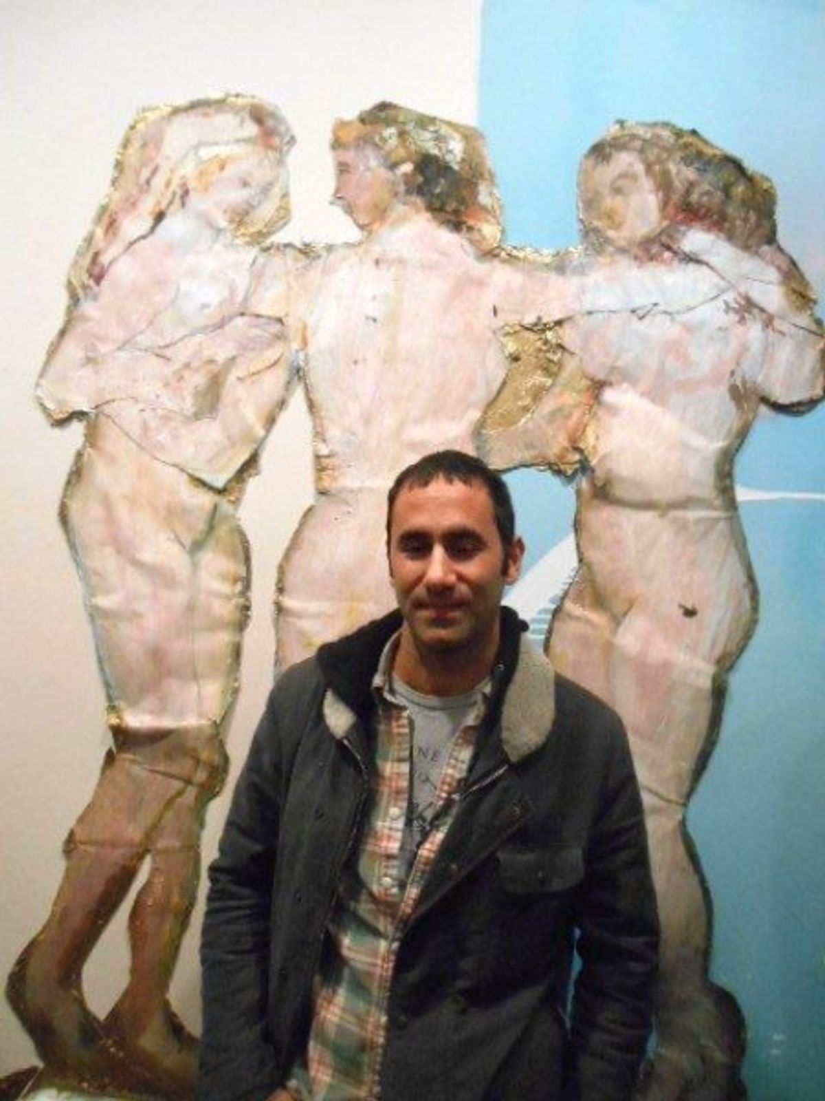 Artist Darius Yektai in front of his painting, Three Graces at 