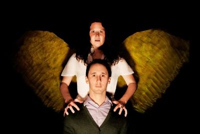 The Angel (Cara Trautman) looks over Louis (Matthew Turner Shelton) Photo