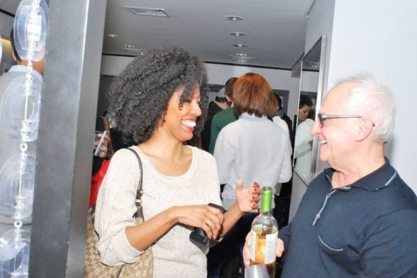 Sing for Hope Volunteer Artist Nakeisha Daniel celebrates with host Vartan Vartali. Photo