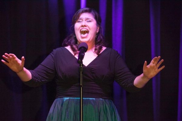 Contestant and finalist, Danielle Painton, sings Get Out And Stay Out Photo