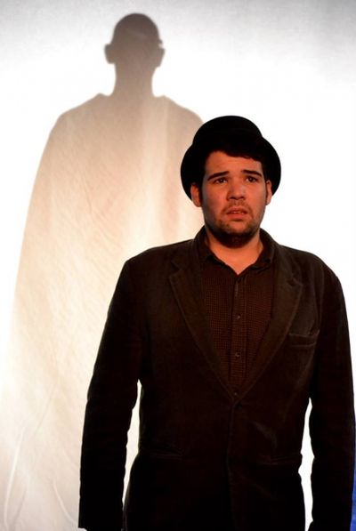Julian Goza as The Beggar with Orlando Iriarte as The Heavenly Photo