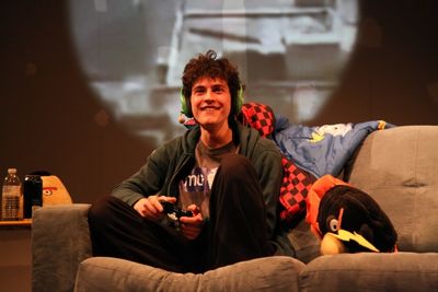 Ian (Clancy McCartney) converses with a fellow gamer  Photo