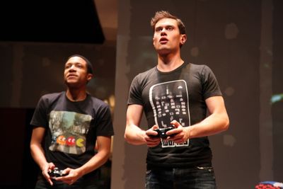 Chuck (Jerry MacKinnon) and Zander (JJ Phillips) become engrossed in a video game Photo