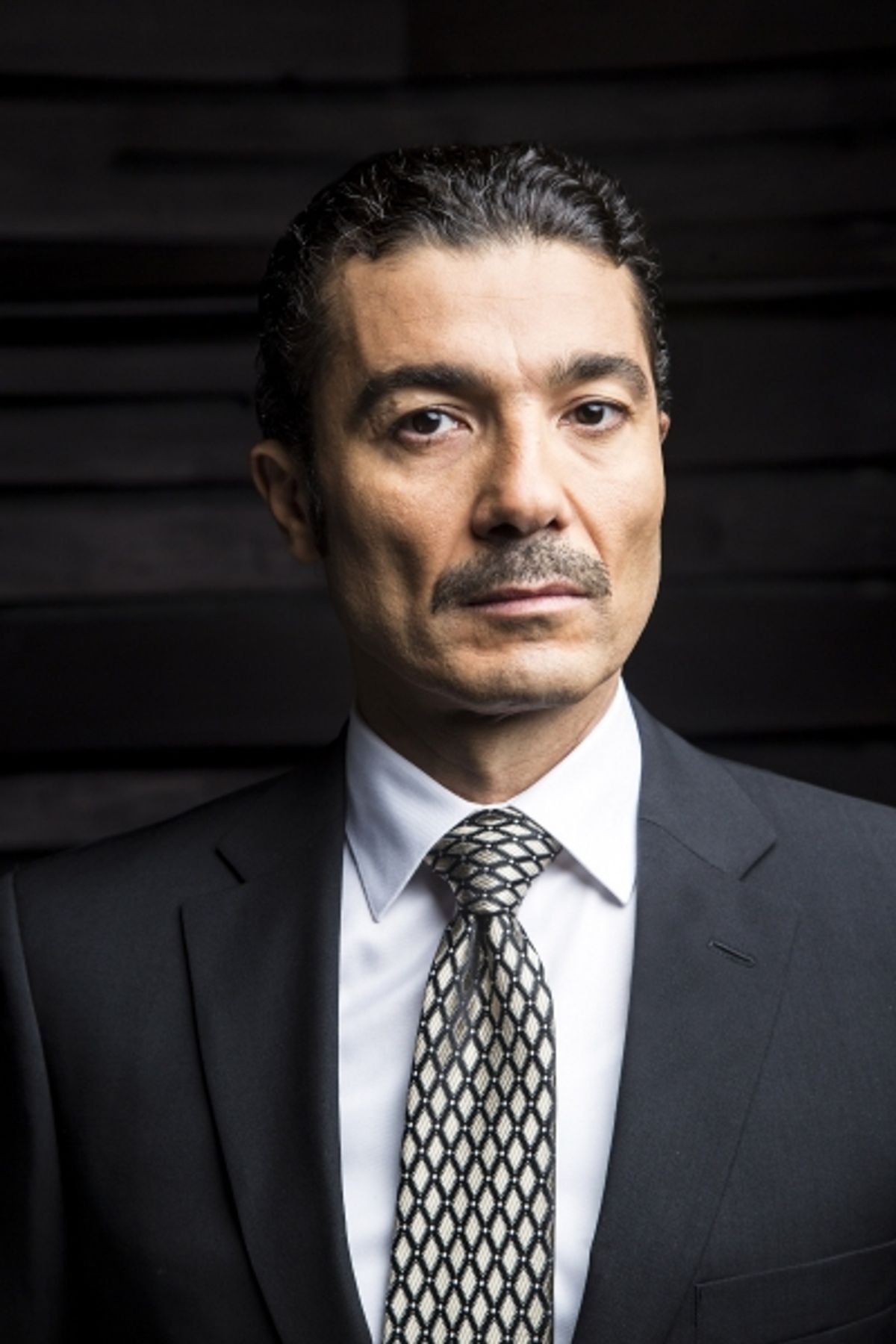 Khaled Nabawy as Egyptian President Anwar Sadat at 