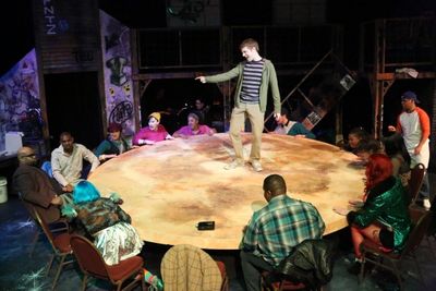 Jeremy Hyatt (as Mark, center) and the cast perform ''La Vie Boheme'' Photo