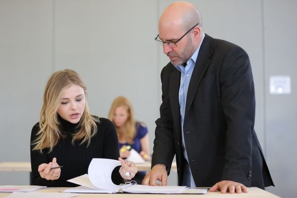 Chloe Grace Moretz and Scott Z. Burns (center) Photo