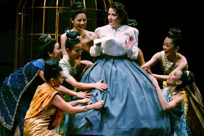 Michele Ragusa (as British schoolteacher Anna Leonowens), center, is surprised to lea Photo