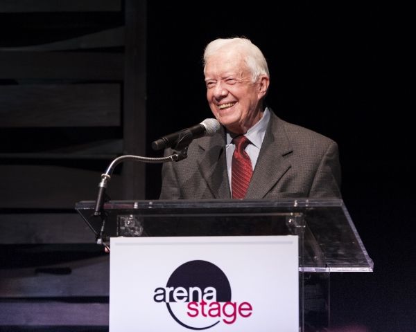President Jimmy Carter addresses dinner guests Photo