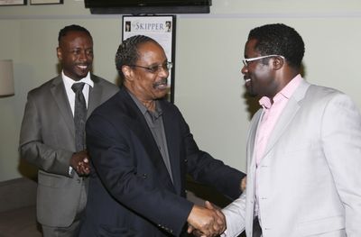 Music Director Kenny J. Seymour and musician Harold Wheeler congratulate Writer/Perfo Photo
