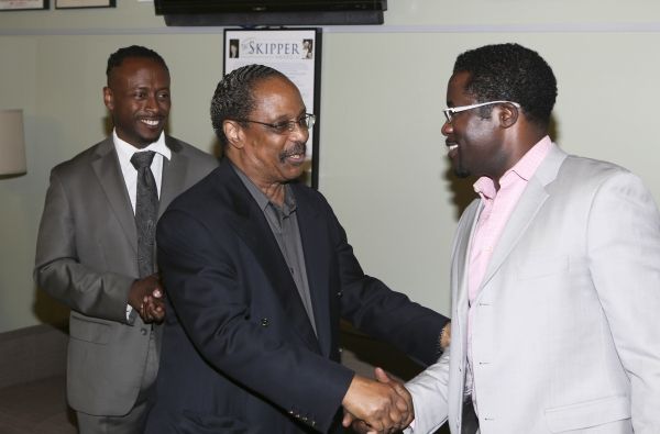 Music Director Kenny J. Seymour and musician Harold Wheeler congratulate Writer/Perfo Photo