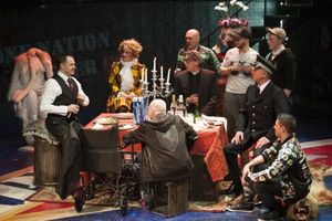 Macheath (Mitchell Jarvis, left) holds court on his wedding day (from left clockwise: Erin Driscoll, Sean Fri, Thomas Adrian Simpson, Paul Scanlan, John Leslie Wolfe, Ryan Sellers, and Rick Hammerly). @ BroadwayWorld Macheath (Mitchell Jarvis, left) holds court on his wedding day (from left clockwise: Photo