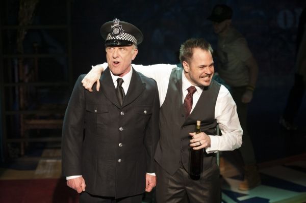 Tiger Brown (John Leslie Wolfe) and Macheath (Mitchell Jarvis) relive their military  Photo