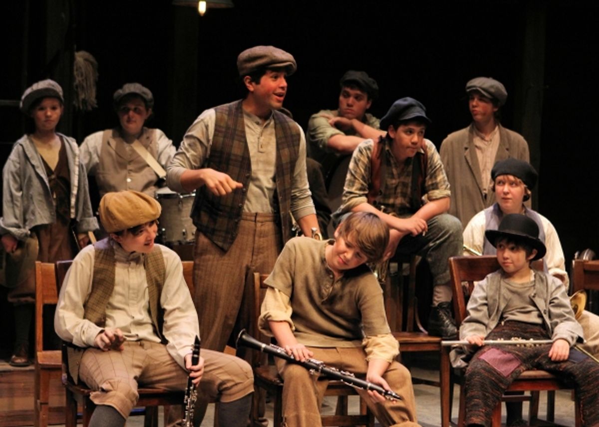 Franky (Ricardo Vazquez) talks back to the Professor during a band rehearsal to show off in front of the other boys (l to r, front row: Elyse Barnard, Jonah Harrison, Joshua Harrison; second row: Jack Alexander, Shelby Ernst; back row: Mary Bair, Atlee Je at 