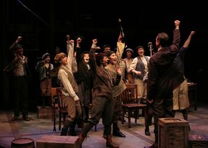 Professor C.C.Heintzeman (Jon Andrew Hegge) gets the boys fired up for the Loyalty Day Parade @ BroadwayWorld Professor C.C.Heintzeman (Jon Andrew Hegge) gets the boys fired up for the Loyalty Da Photo