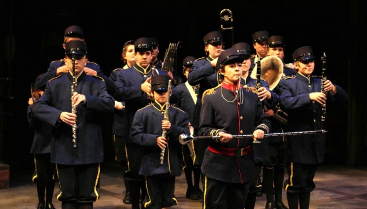 The boys band, led by drum major Andy (Christian Bardin) rehearse for the Loyalty Day Parade at 