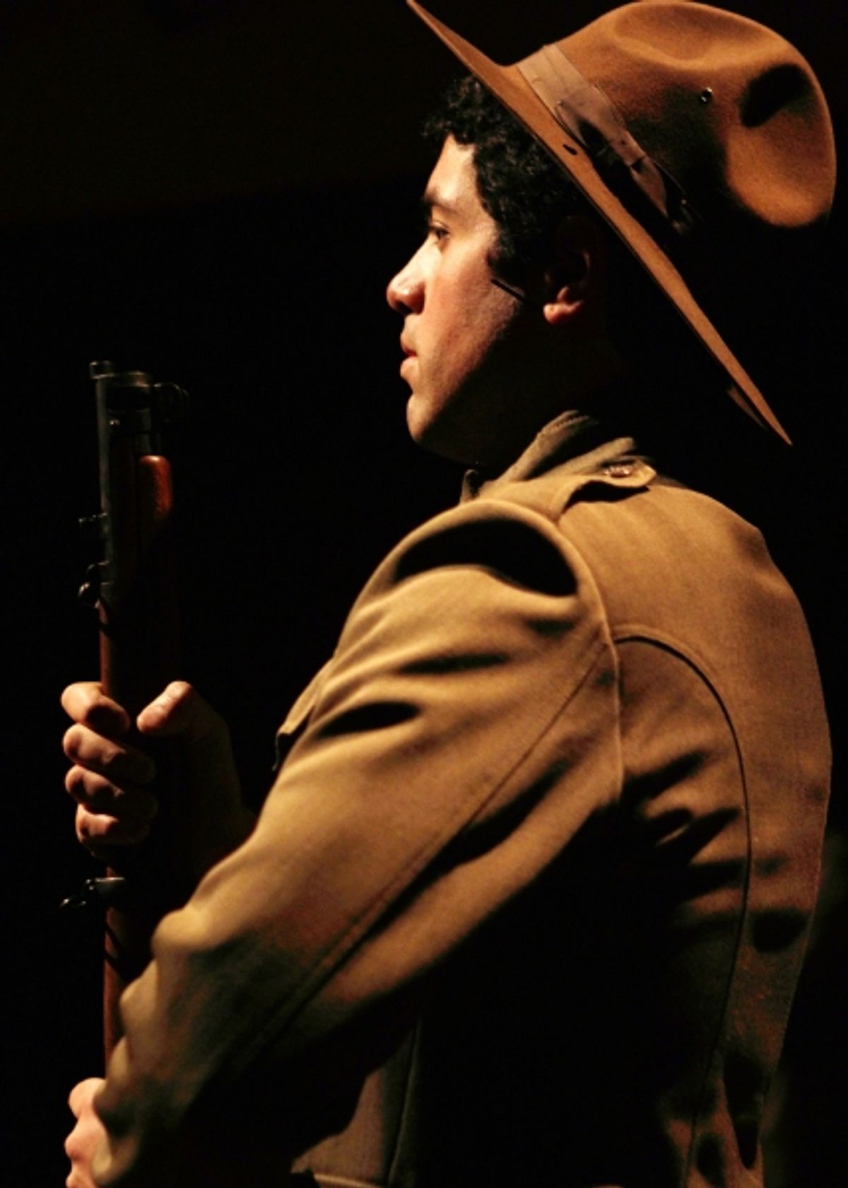 Franky (Ricardo Vazquez) marches with his unit of newly drafted soldiers in the Loyalty Day Parade of 1917 at 