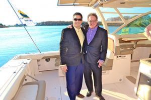 Doug Petri and Bruce T. Sloane on the Grady White boat provided by the Port of Egypt to cruise guests to see the Steinbeck writing cottage from the water. @ BroadwayWorld Doug Petri and Bruce T. Sloane on the Grady White boat provided by the Port of Egypt Photo