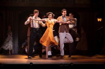 Caroline Bowman as Eva Peron with the cast of the National Tour of EVITA Photo