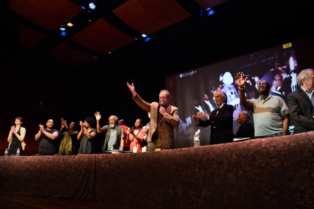 Actor Playwright Jay O. Sanders and the cast of Unexplored Interior greet the audience in Rwanda (seen behind them onscreen) at 