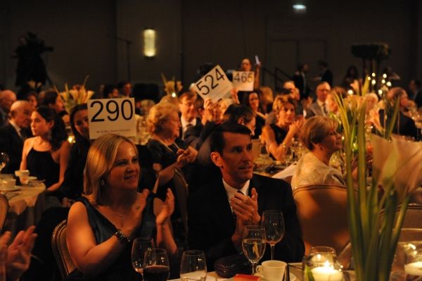 Sarah J. Nolan, left, and Bill Hinz applaud bidders during Hubbard StreetÃ¢â‚¬ Photo