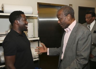 Daniel Beaty is congratulated by actor Sidney Poitier Photo