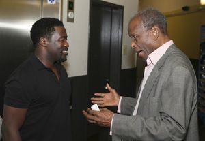 Daniel Beaty is congratulated by actor Sidney Poitier Photo