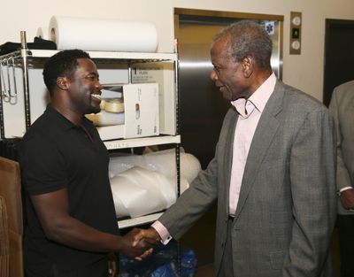 Daniel Beaty is congratulated by actor Sidney Poitier Photo