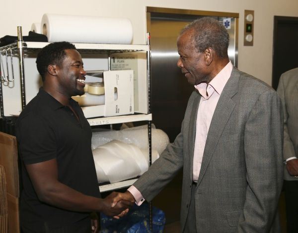 Daniel Beaty is congratulated by actor Sidney Poitier Photo