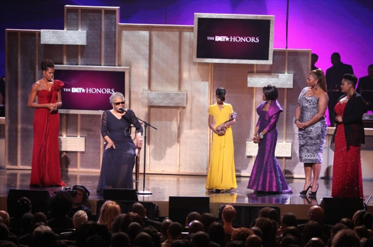 Michelle Obama with Maya Angelou, Willow Smith, Cicely Tyson, Queen Latifah and Jill Scott onstage during the BET Honors 2012 at the Warner Theatre on January 14, 2012 in Washington, DC. at 