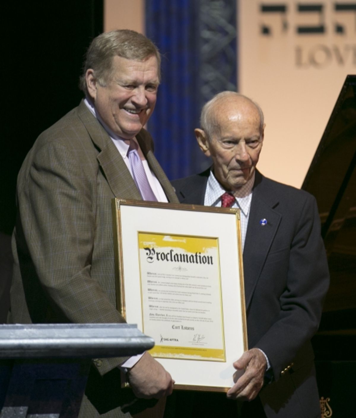 Ken Howard, President of SAG-AFTRA presents a proclamation on  behalf of SAG-AFTRA to Holocaust survivor and hero of the Dutch Resistance  Curt Lowens at An International Evening of Music and Remembrance celebrating   the Voices of Holocaust Survivors thr at 