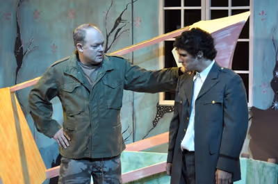 George Anrobus (Bill Claussen) reconciles with his son Henry (David Scott), who has r Photo