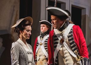 Judith Anderson (Elizabeth A. Davis) refuses to abandon Richard, even as the British Sergeant (Sheffield Chastain) orders her to step aside. @ BroadwayWorld Judith Anderson (Elizabeth A. Davis) refuses to abandon Richard, even as the British Photo