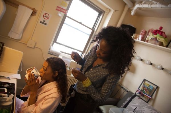 Nikki M. James sneaks in a cup of coffee as Assistant Hair Supervisor Amber Morrow… Photo