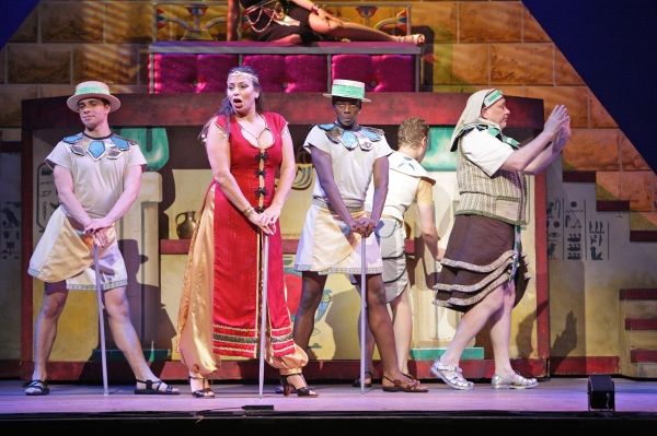 The Narrator (Darcie Roberts) and her fellows (Luke Steinhauer, Wonza Johnson) give a Photo